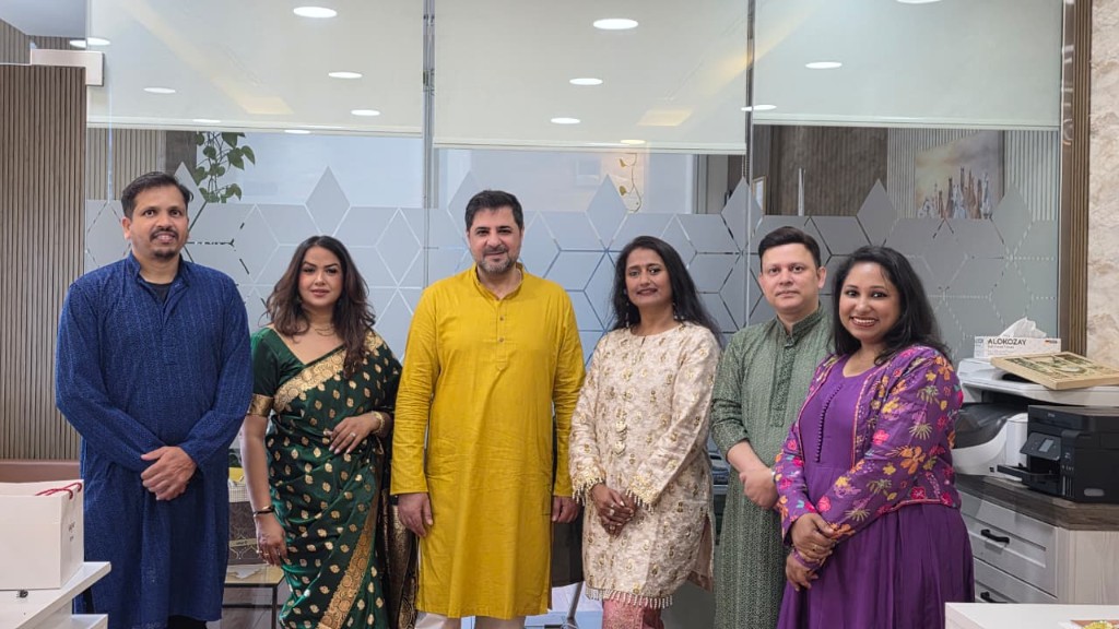 Money Matters team celebrating in traditional attire